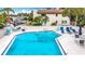 Inviting community pool with plenty of lounge chairs at 2750 E Bay Dr # 3B, Largo, FL 33771