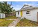 Cozy backyard with a wooden fence, small patio, and shed at 2860 4Th S Ave, St Petersburg, FL 33712