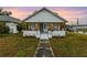 House exterior showcasing a renovated bungalow with a covered porch at 2860 4Th S Ave, St Petersburg, FL 33712