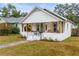 Charming bungalow with a covered porch and well-maintained lawn at 2860 4Th S Ave, St Petersburg, FL 33712