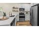 Modern kitchen with stainless steel appliances and white shaker cabinets at 2860 4Th S Ave, St Petersburg, FL 33712