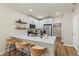 Modern kitchen with white cabinets, quartz countertops, and stainless steel appliances at 2860 4Th S Ave, St Petersburg, FL 33712