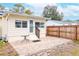 Fenced backyard with patio and access to the home at 310 W Hilda St, Tampa, FL 33603