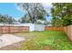 Spacious backyard with a storage shed and wooden fence at 310 W Hilda St, Tampa, FL 33603