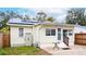 Home features a backyard with a patio and solar panels at 310 W Hilda St, Tampa, FL 33603