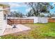 Large backyard with a storage shed and wooden fence at 310 W Hilda St, Tampa, FL 33603