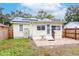 Charming home with a fenced backyard, patio, and storage shed at 310 W Hilda St, Tampa, FL 33603