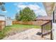 Fenced backyard with patio and storage shed at 310 W Hilda St, Tampa, FL 33603