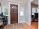 Inviting entryway with hardwood floors and a view to the living room at 310 W Hilda St, Tampa, FL 33603