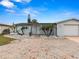 Front view of a single story home with brick driveway at 3148 Domino Dr, Holiday, FL 34691