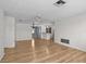 Light and airy living room featuring hardwood floors and chandelier at 3148 Domino Dr, Holiday, FL 34691