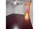 Large bedroom with hardwood floors and double doors at 3417 Dragon View Ct # 3417, Valrico, FL 33594