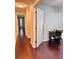 Long hallway with hardwood floors and neutral walls at 3417 Dragon View Ct # 3417, Valrico, FL 33594