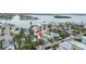 Aerial view of a house's location in a waterfront community, near a canal and other homes at 342 Boca Ciega Dr, Madeira Beach, FL 33708