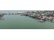 Aerial view of waterfront with bridge and shops at 342 Boca Ciega Dr, Madeira Beach, FL 33708