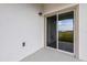 Sliding glass door leading to a private patio at 35605 Buttonweed Trl, Zephyrhills, FL 33541