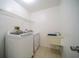 Laundry room with washer, dryer, and utility sink at 364 San Ambrosio St, Punta Gorda, FL 33983