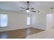 Spacious living room featuring wood-look floors and a ceiling fan at 364 San Ambrosio St, Punta Gorda, FL 33983