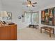 Bedroom with window, ceiling fan, and wood furniture at 4994 Klosterman Oaks Blvd, Palm Harbor, FL 34683