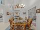 Dining area with a glass-top table and wicker chairs, near the kitchen and laundry at 4994 Klosterman Oaks Blvd, Palm Harbor, FL 34683