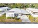 Mobile home with carport and surrounding landscape at 5149 Jo St, Zephyrhills, FL 33542