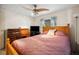 Bedroom featuring a queen-size bed and a desk at 5149 Jo St, Zephyrhills, FL 33542