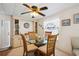 Dining area with glass table and four chairs at 5149 Jo St, Zephyrhills, FL 33542