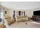 Living room with beige leather furniture and a fireplace at 5149 Jo St, Zephyrhills, FL 33542