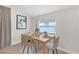 Charming dining area featuring a wood table and four light grey chairs at 5161 Rena N St, St Petersburg, FL 33709