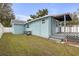 Light blue house exterior with deck and fenced yard at 5161 Rena N St, St Petersburg, FL 33709