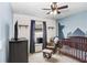 Bedroom featuring a crib, rocker, and built-in shelving at 5403 Fez Ct, Brooksville, FL 34602