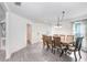 Bright dining room with hardwood floors and a large table, perfect for Gathering gatherings at 5403 Fez Ct, Brooksville, FL 34602