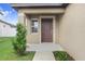 House exterior featuring a dark brown front door at 5403 Fez Ct, Brooksville, FL 34602