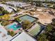 Aerial view of community amenities, including tennis and shuffleboard at 5750 80Th St N # B106, St Petersburg, FL 33709