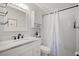 Clean bathroom with white vanity, marble countertop, and a shower/tub combo at 5750 80Th St N # B106, St Petersburg, FL 33709