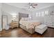 Spacious bedroom with plush bed, wood floors, and plenty of natural light at 5750 80Th St N # B106, St Petersburg, FL 33709