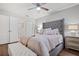 Bright bedroom with a comfortable bed and en-suite bathroom access at 5750 80Th St N # B106, St Petersburg, FL 33709