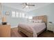 Charming bedroom with light wood furniture and plenty of closet space at 5750 80Th St N # B106, St Petersburg, FL 33709