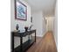 Bright entryway with hardwood floors and console table at 5750 80Th St N # B106, St Petersburg, FL 33709