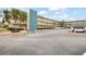 Building exterior showcasing ample parking and landscaping at 5750 80Th St N # B106, St Petersburg, FL 33709