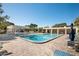 Community pool with lounge chairs and patio area at 5750 80Th St N # B106, St Petersburg, FL 33709