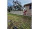 Large backyard with a vinyl fence and tropical plants at 5805 34Th S Ave, Tampa, FL 33619