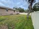 Backyard with grassy area and a fence at 5805 34Th S Ave, Tampa, FL 33619