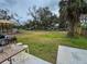 Large backyard with grill, patio furniture, and a playground at 5805 34Th S Ave, Tampa, FL 33619