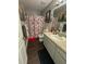 Clean bathroom with shower/tub combo and updated vanity at 5805 34Th S Ave, Tampa, FL 33619