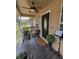 Front porch with wicker furniture and potted plants at 5805 34Th S Ave, Tampa, FL 33619