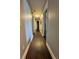 Long hallway with dark flooring and barn-style doors at 5805 34Th S Ave, Tampa, FL 33619