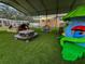 Outdoor play area with artificial turf and play structures at 5805 34Th S Ave, Tampa, FL 33619