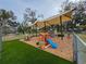 Outdoor play area with shaded structure and various playsets at 5805 34Th S Ave, Tampa, FL 33619