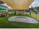 Play area with shaded structure, artificial turf, and play equipment at 5805 34Th S Ave, Tampa, FL 33619